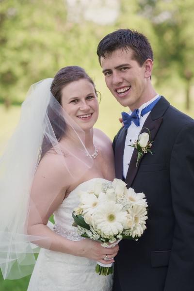 A married couple smiles together