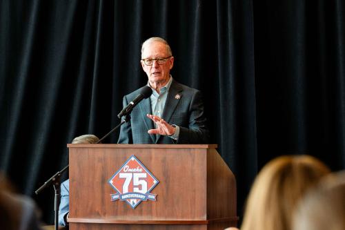 A man speaks at a lectern