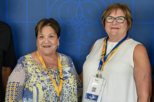 Two smiling women pose for a photo