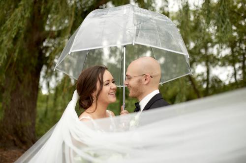 Mary and Zach Grossman pose together on their wedding day