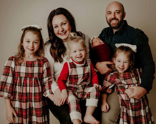 A family poses together for a photo