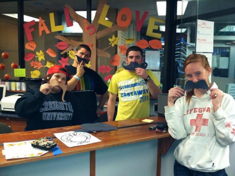 Students pose with fake mustaches