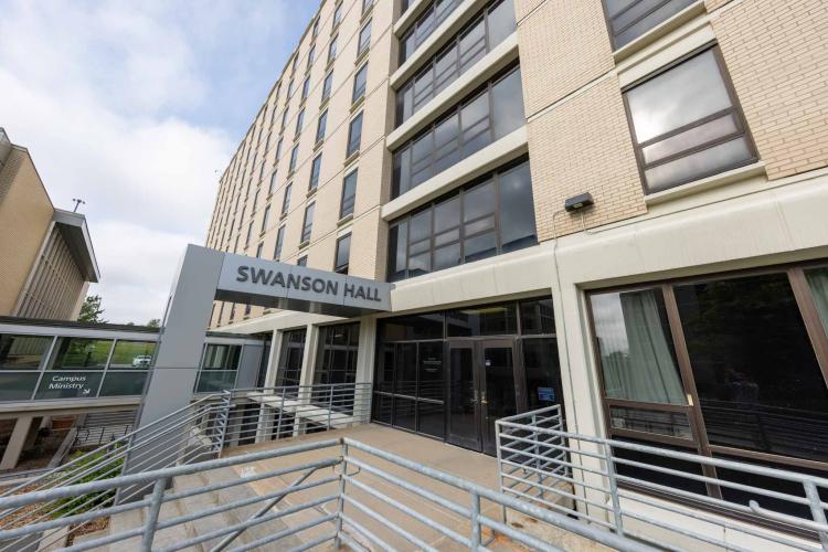 An exterior photo of a residence hall entrance