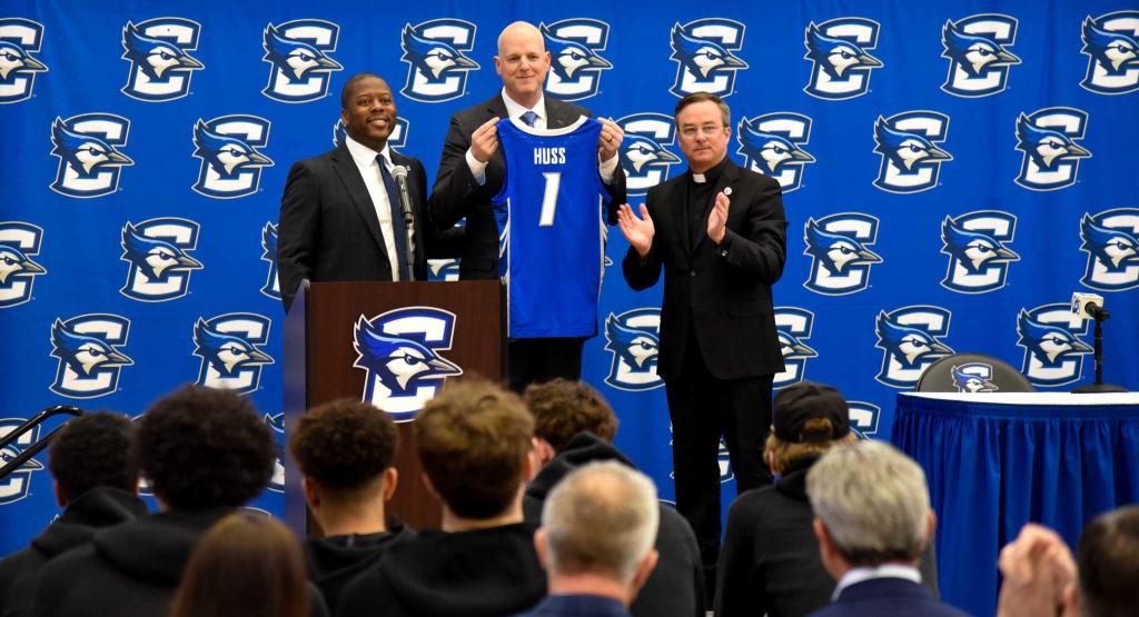 A basketball coach is introduced