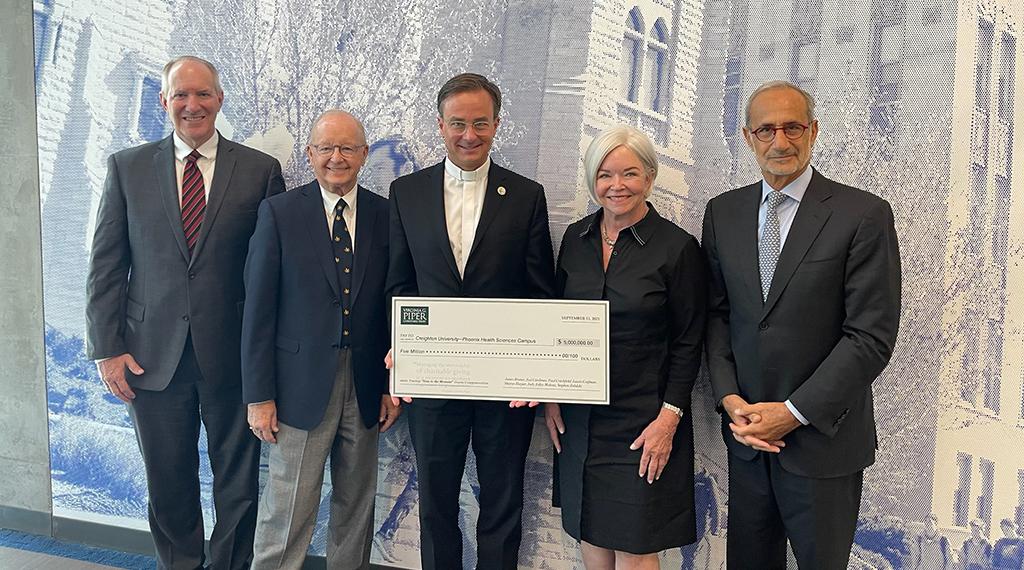 Piper Trustee Steve Zabilski, Piper Trustee Paul Critchfield, Fr. Daniel S. Hendrickson, Piper CEO and President Mary Jane Rynd and Creighton Board Chair Nizar Ghoussaini, BS’75, MS’76.