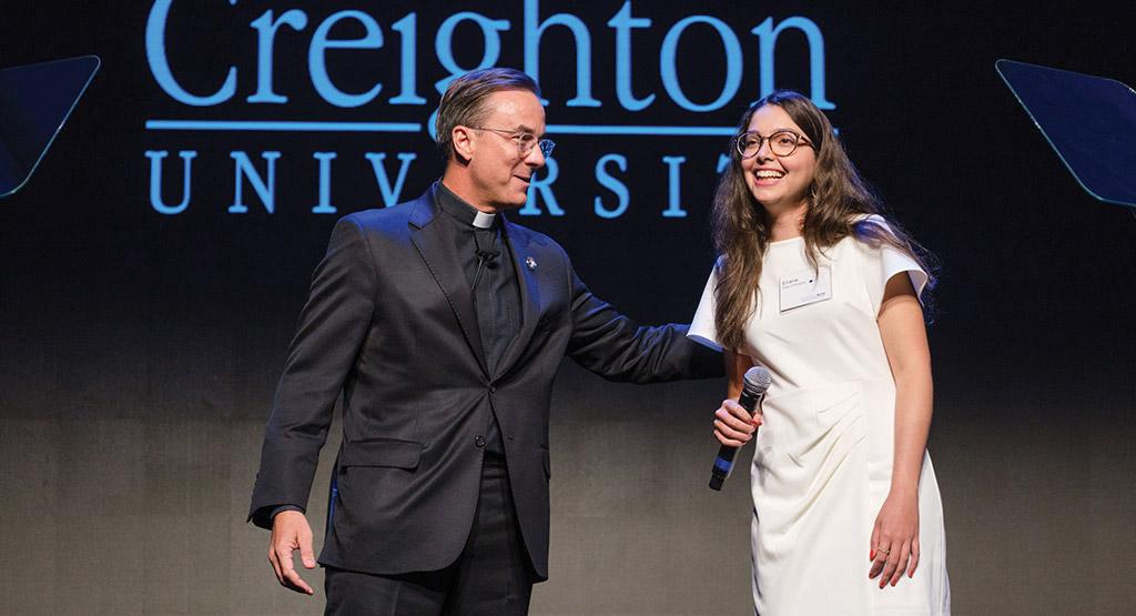 Creighton President the Rev. Daniel S. Hendrickson, SJ, PhD, talks with student Eliana Rodriguez at the Forward Blue launch event.