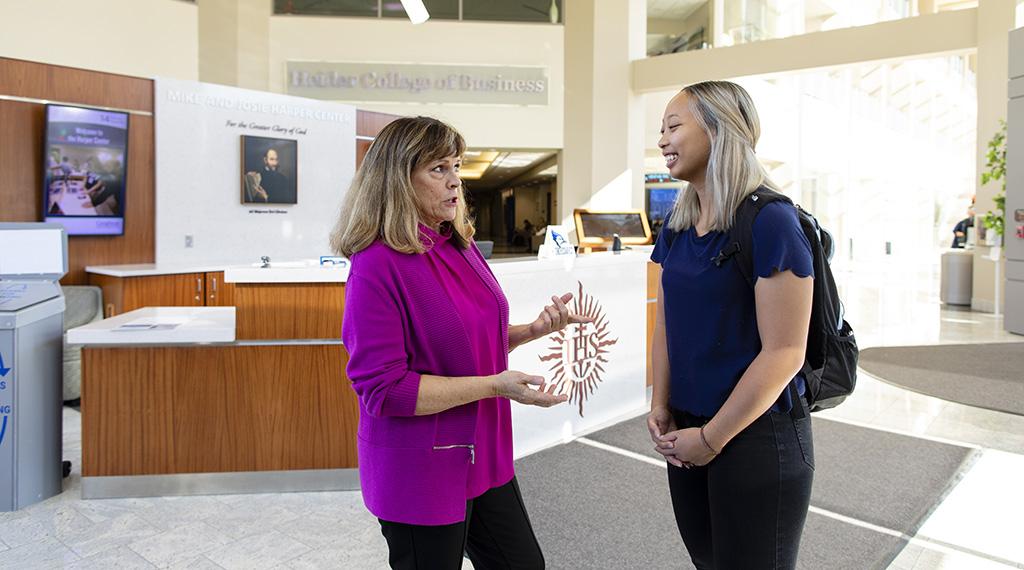 Debbie Wells speaks with a student