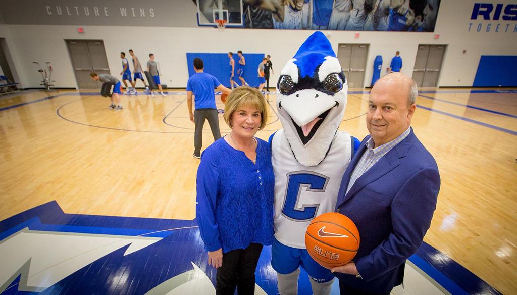 Janie and Harry Hoch, Jr. pose with Billy Bluejay.