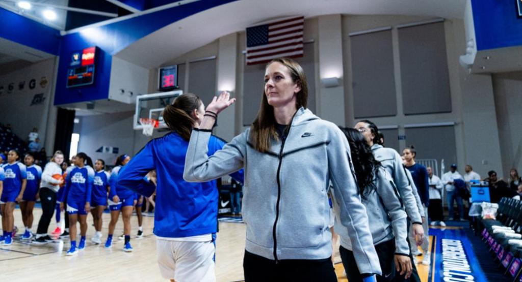Jenny Vickers high-fives Creighton women's basketball players