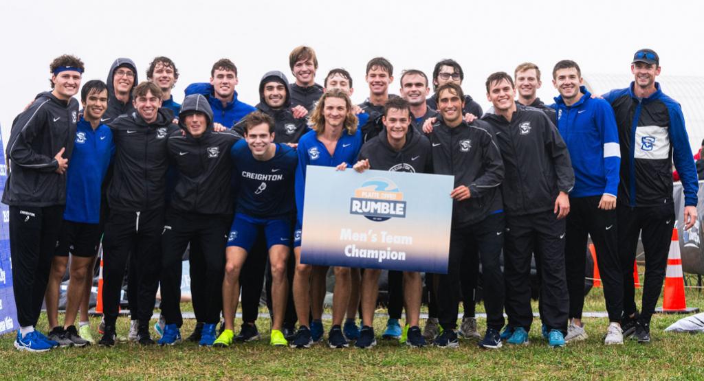 Creighton men's cross country team stands together after winning a meet