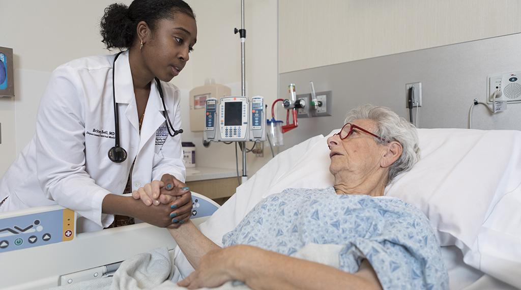 Britney Bell talks with a patient