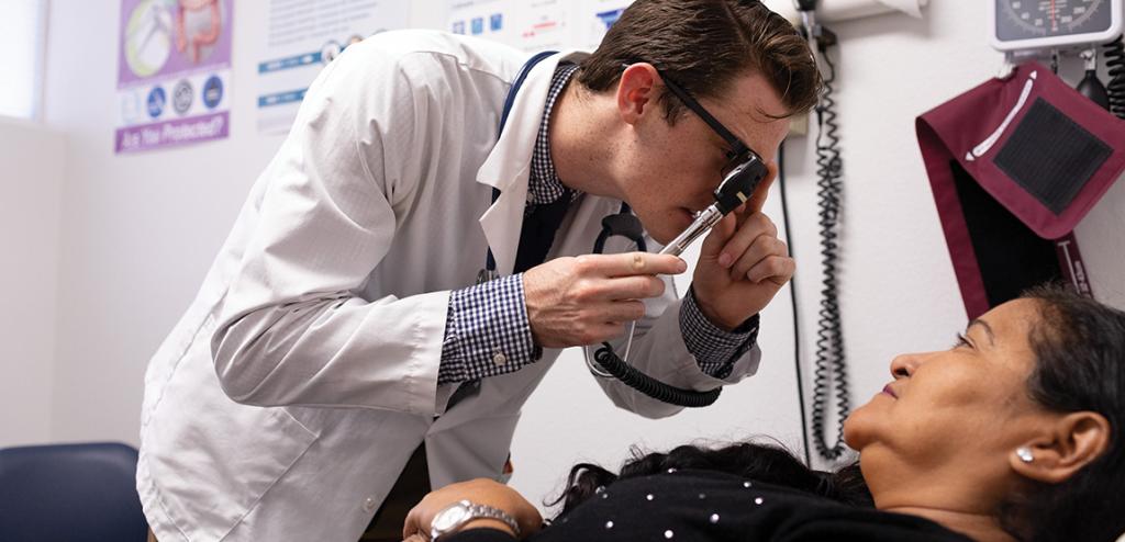 Physician examines a patient at St. Vincent