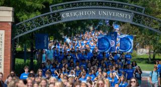 Hundreds of students walk down the Creighton Mall