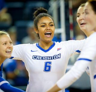 Creighton volleyball players celebrating