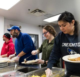 Creighton students in community service for Schlegel Center for Service and Justice