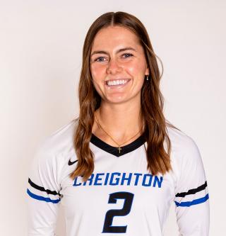 A volleyball player smiles