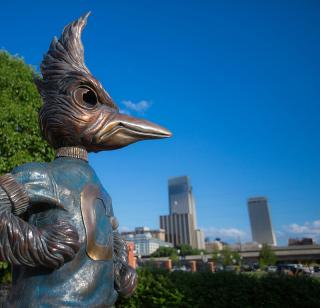 Billy bluejay statue overlooks the city.