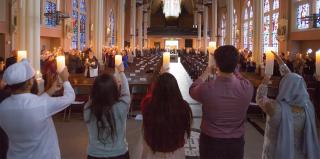 A group of people worship at St. John's Church.