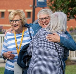 Alumnae embrace at Creighton Days