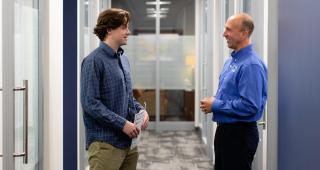 Jeremy Fisher speaks with a student in the Career Center.