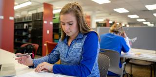 A student studying in the library.