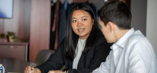 Graduate students in conference room