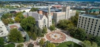 Aerial view of St. John's Church and fountain and Creighton Hall