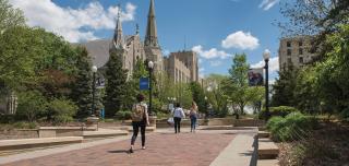 Several Creighton students walk on the mall