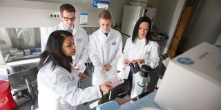 Creighton dental faculty member instructs three dental students