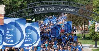 Creighton students walk under the pathway