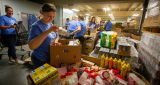 A student helps out at Sacred Heart mission.