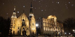 St. John's Church and Creighton Hall at night in winter