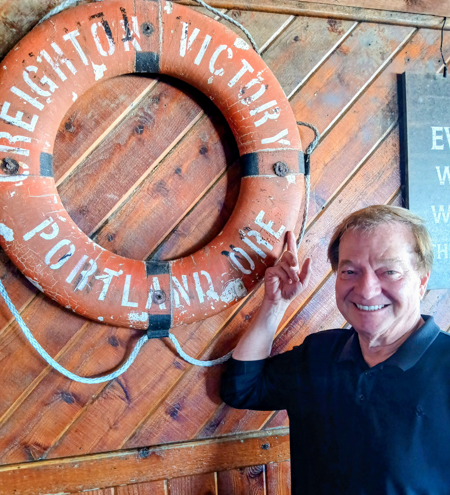 Tom Adams with the S.S. Creighton Victory life preserver. 