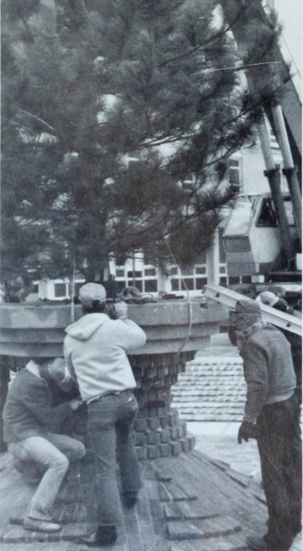 The Christmas tree goes up in front of St. John's.