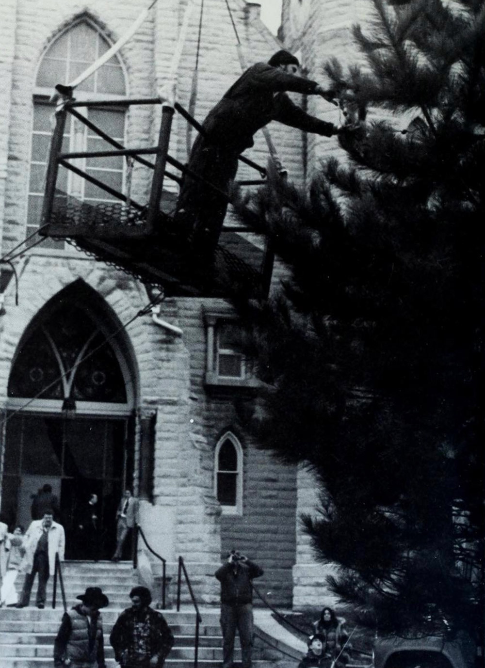 The Christmas tree goes up in front of St. John's.