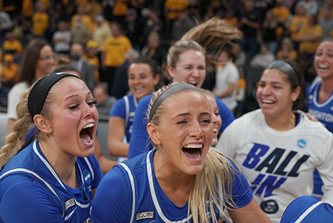 Women's basketball team celebrates at their NCAA Tournament bid announcement party.