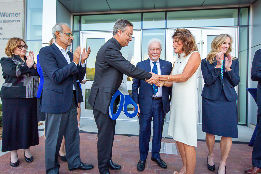 Pictured from left to right: Mary Kunes-Connell, Nizar Ghoussaini, Father Hendrickson, CL Werner, Rachel Werner, Mardell Wilson