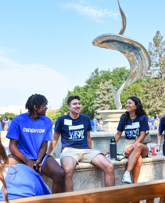 Creighton students sit by the St. John's Fountain during Welcome Week. Creighton students sit by the St. John's Fountain during Welcome Week.