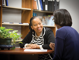 School of Law faculty meets with client