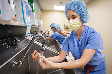 Physician washes hands.