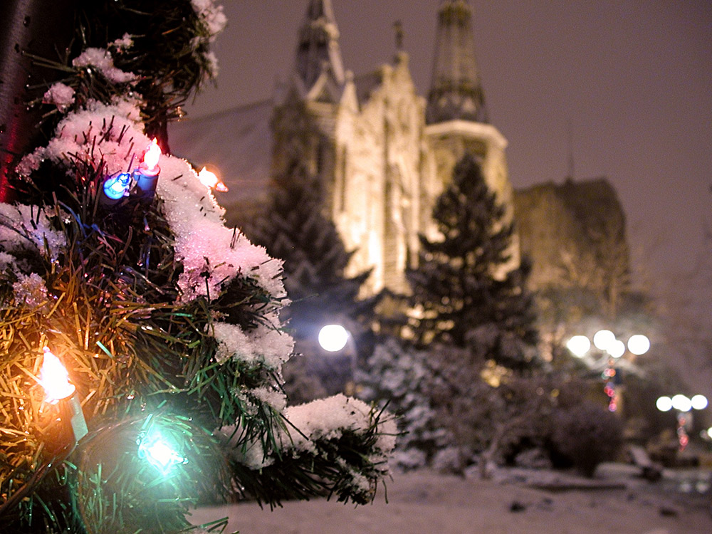 A snowy Christmas scene in front of St. John's.